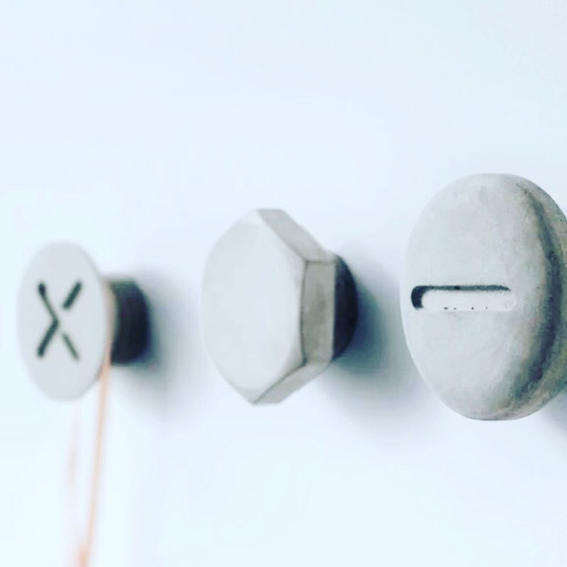 Screwed-Up Concrete Wall Hooks